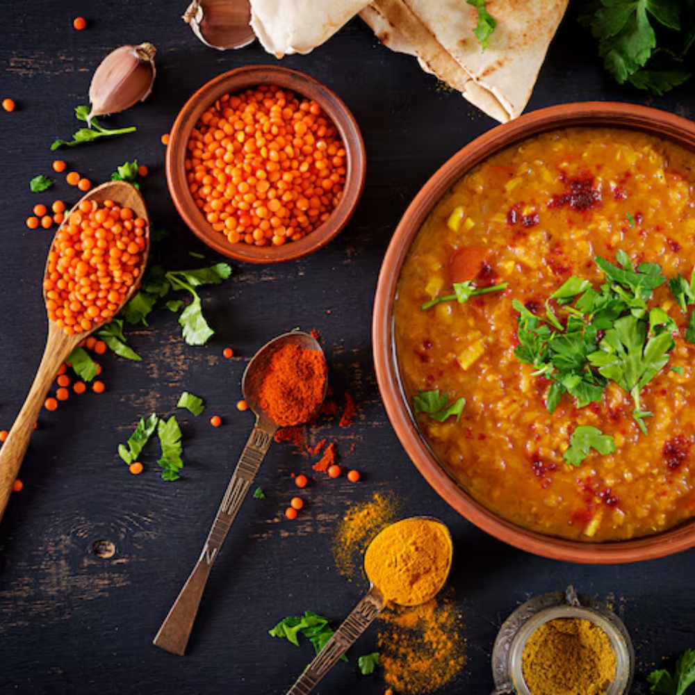 traditional-indian-soup-lentils-indian-dhal-spicy-curry-bowl-spices-herbs-rustic-black-wooden-table